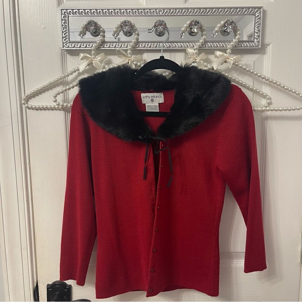 Red button down cardigan with black fur trim